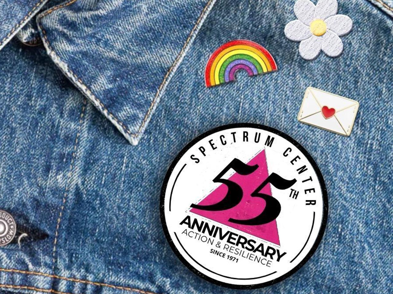jean jacket with Spectrum Center 55th anniversary pin 