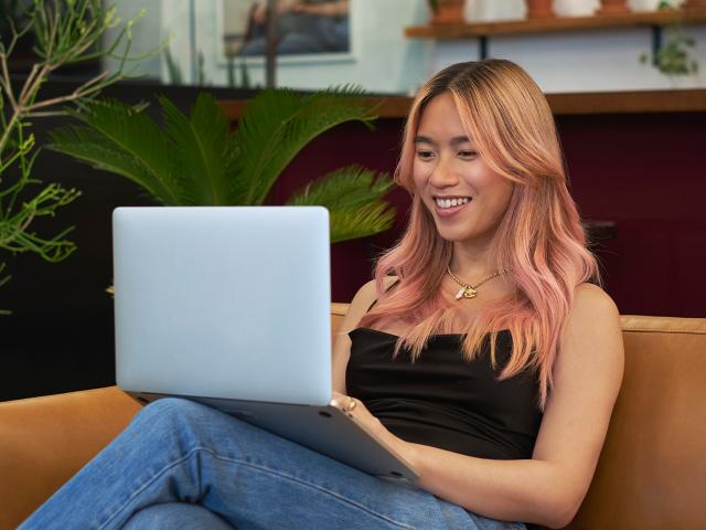 Photo of a transfem person using their computer. Photo by Vice Gender Spectrum Collection.