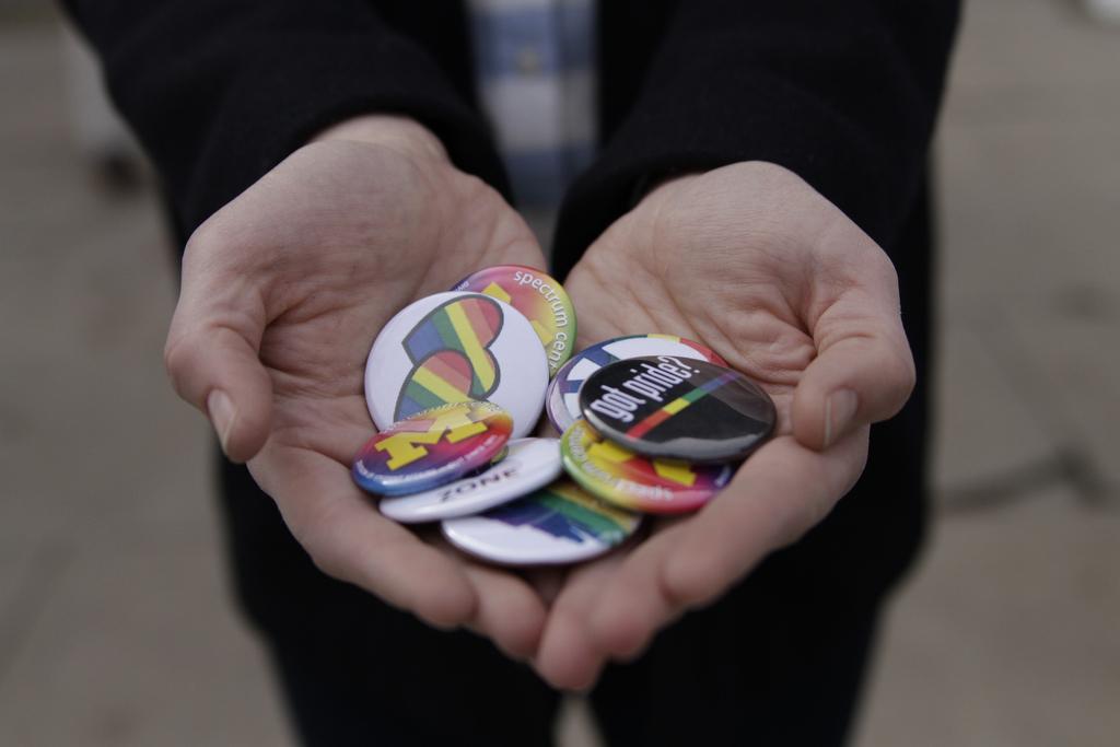 rainbow buttons in hands